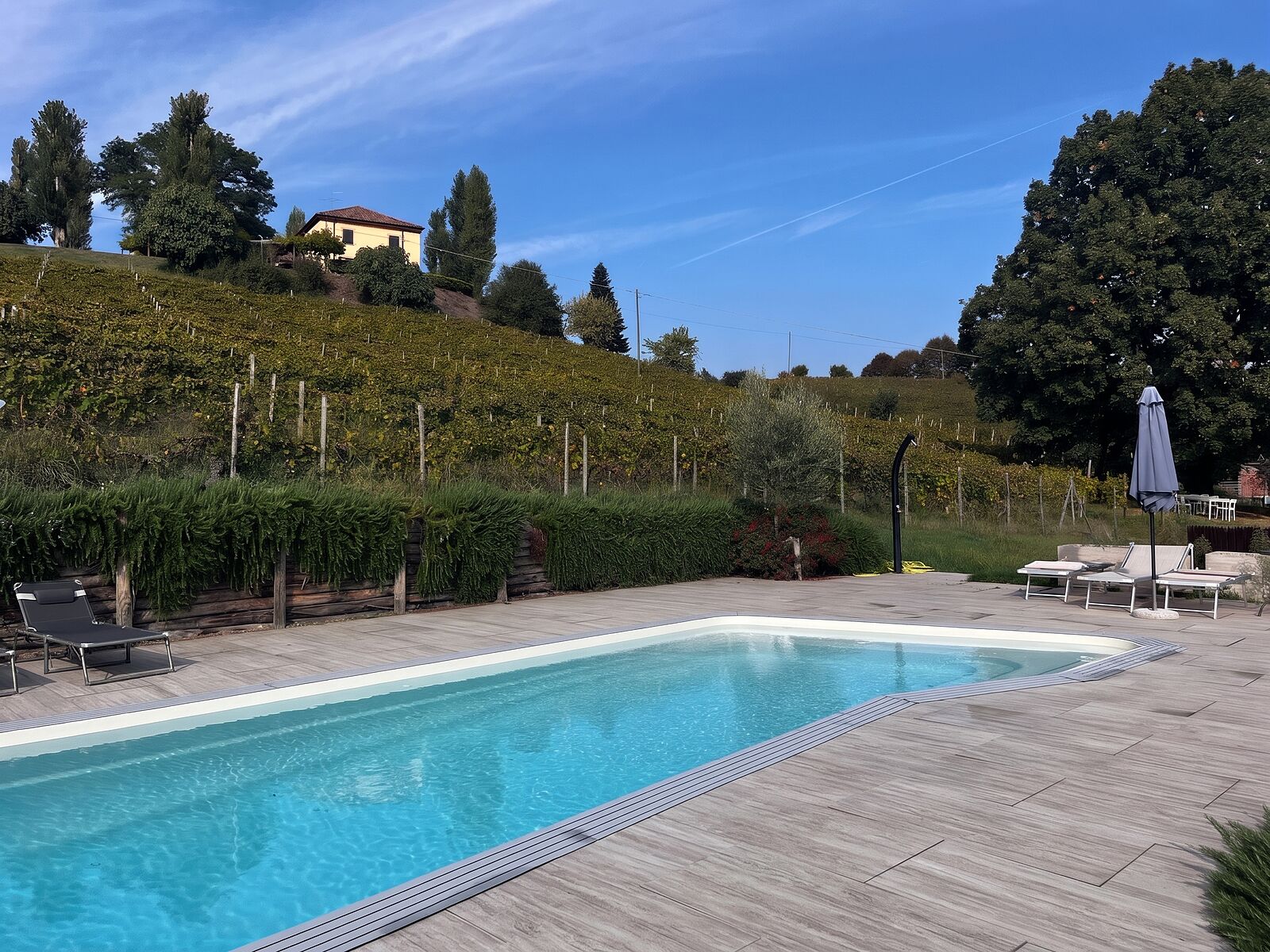 The pool at Cascina Blon, looking out over the vineyards