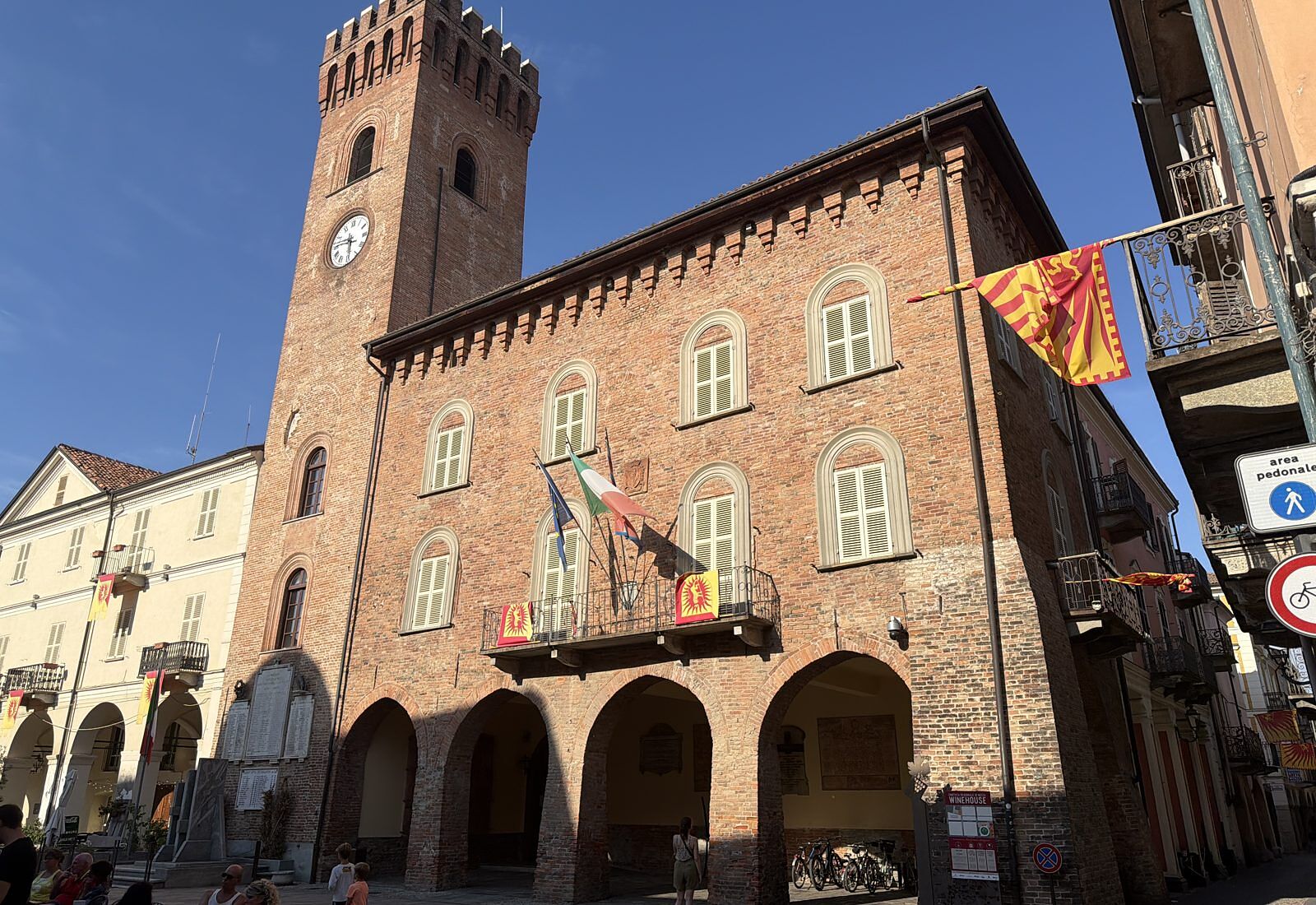 The Campanòn and the town-hall arcades in Nizza Monferrato, with bikes parked underneath